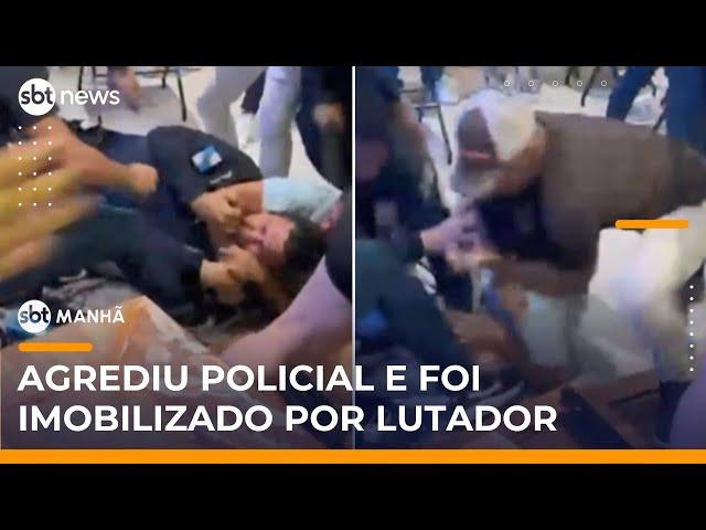 Homem agride policial em bar e é imobilizado por lutador de MMA | #SBTManhã