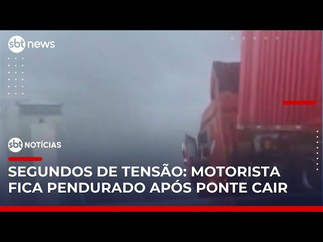 Caminhão fica pendurado à beira de rodovia após ponte desabar na China | #SBTNotícias